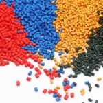 Masterbatch pellets in various colors, used for coloring and enhancing properties in plastic manufacturing processes