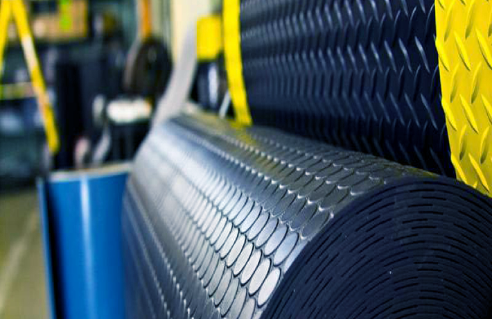 Rubber Industry: Rows of rubber trees being tapped for latex, highlighting the natural sourcing process integral to the rubber industry's production.