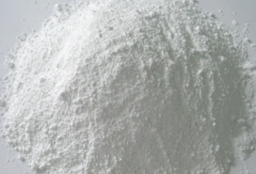 Close-up of calcite powder, a finely ground form of calcium carbonate mineral used in various industries such as construction, agriculture, and pharmaceuticals for its properties including whiteness, brightness, and as a filler or extender