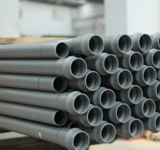 U-PVC Pipes: Stacks of white U-PVC pipes arranged neatly, demonstrating the versatility, durability, and functionality of U-PVC piping systems."